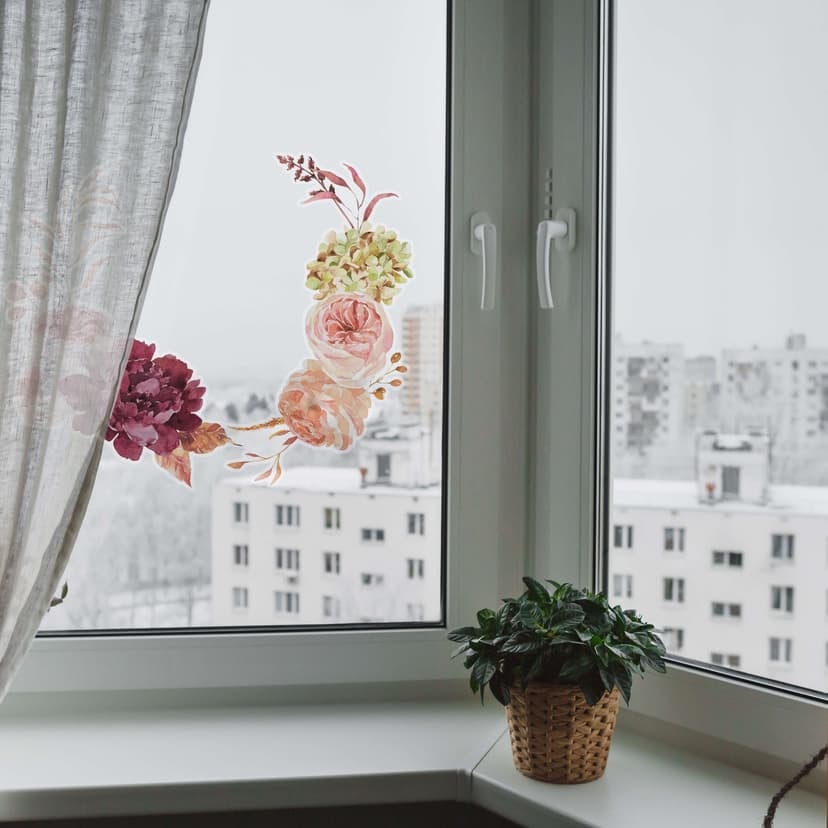 Fönsterbild: blommor i en höstkrans
